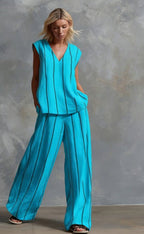 Women’s sleeveless striped top and full-length pants casualwear set by FitiqueFit, shown on a model with a relaxed fit.