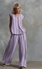 Women's sleeveless striped top and full-length casual pants set by FitiqueFit, featuring a stylish, comfortable summer outfit.