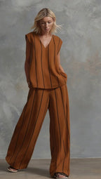 Women’s sleeveless striped top and full-length pants casualwear set by FitiqueFit, featuring a stylish sleeveless top with vertical stripes.