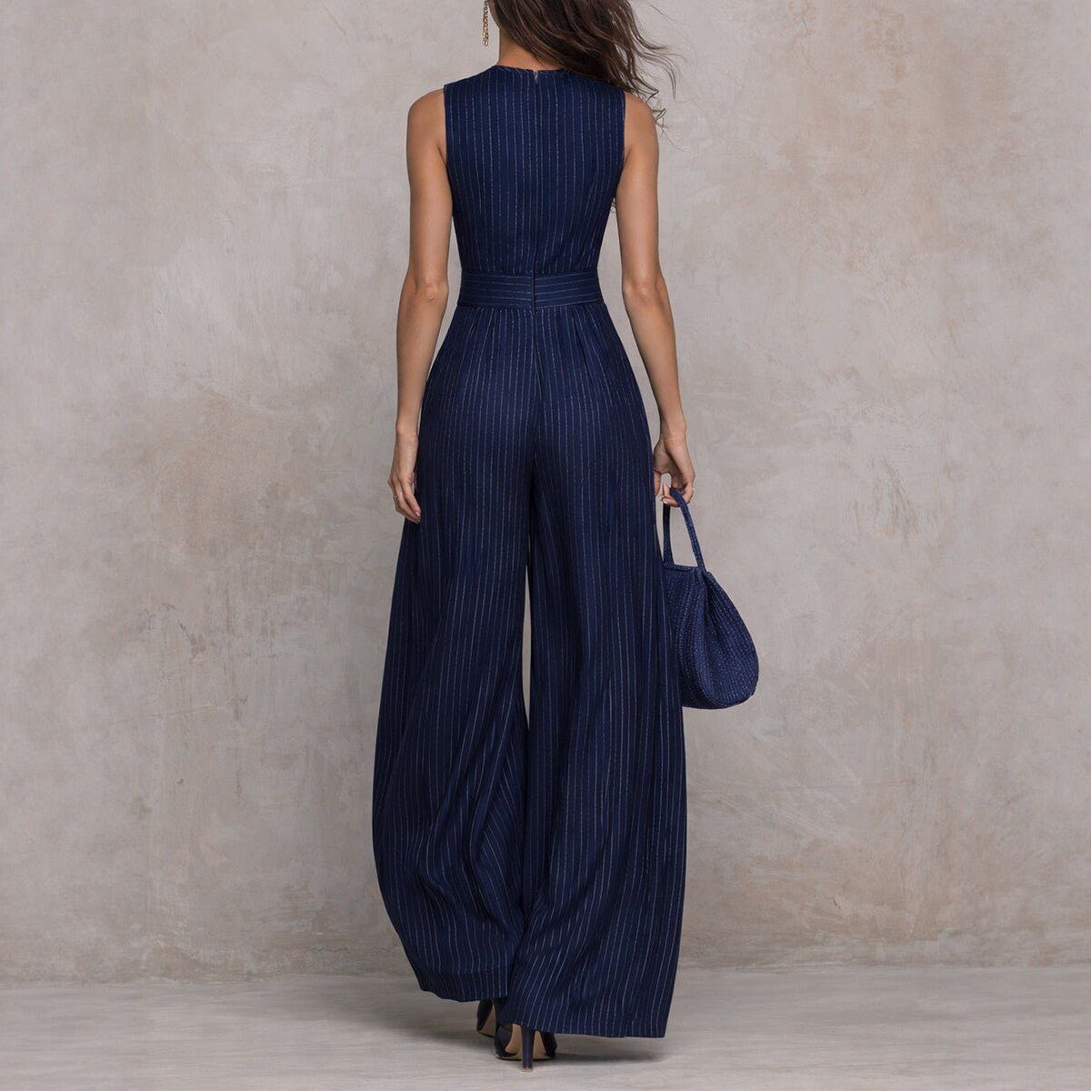 Women's sleeveless striped wide-leg jumpsuit with pockets, casual FitiqueFit brand, perfect for warm weather and relaxed style.