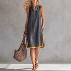 Women's sleeveless V-neck button-front A-line midi dress with pockets, casualwear by FitiqueFit, shown on a model.