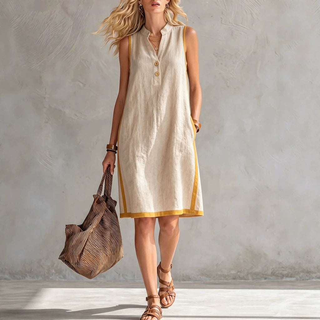 Women's sleeveless V-neck button-front A-line midi dress with pockets, casualwear by FitiqueFit, shown on a model.