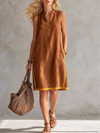 Women's sleeveless V-neck button-front A-line midi dress with pockets, casualwear by FitiqueFit, shown in a stylish, flowy design.