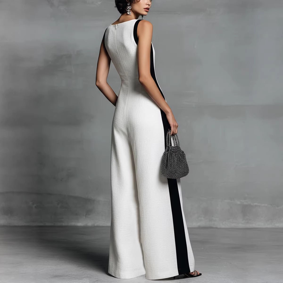 Women's sleeveless V-neck contrast color wide-leg jumpsuit by FitiqueFit, shown in a casualwear style with relaxed fit and stylish design.
