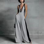 Women’s sleeveless V-neck contrast color wide-leg jumpsuit by FitiqueFit, showcasing its stylish design and flowing fabric.