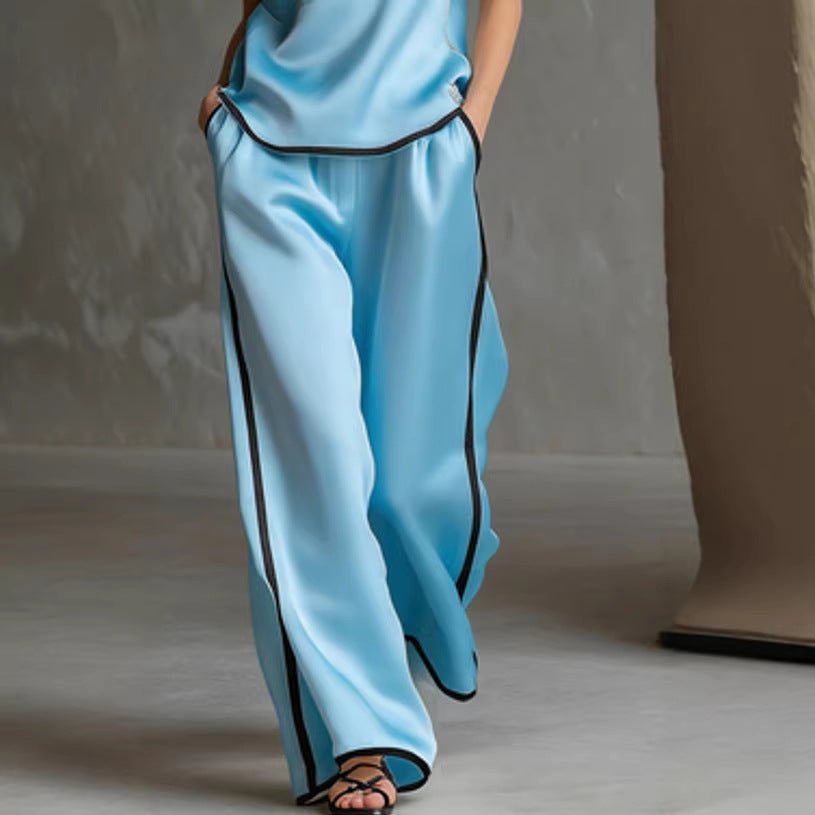 Women’s sleeveless V-neck wide-leg pants set by FitiqueFit, casualwear with a relaxed fit and stylish V-neck top and flowing pants.