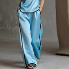 Women’s sleeveless V-neck wide-leg pants set by FitiqueFit, casualwear with a relaxed fit and stylish V-neck top and flowing pants.