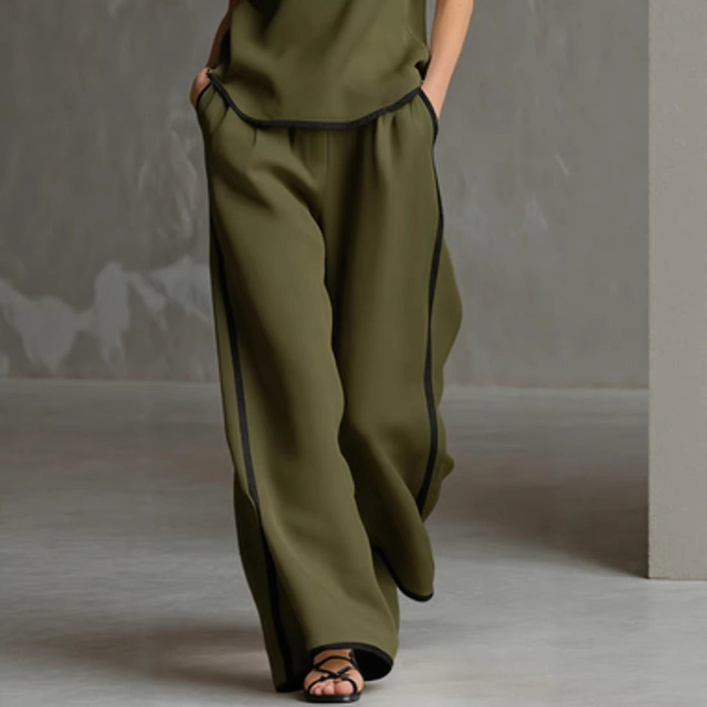 Women’s sleeveless V-neck wide-leg pants set by FitiqueFit, casualwear featuring a stylish V-neck top and flowy wide-leg pants.