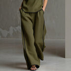 Women’s sleeveless V-neck wide-leg pants set by FitiqueFit, casualwear featuring a stylish V-neck top and flowy wide-leg pants.