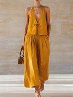Women's sleeveless vest and wide-leg pants set by FitiqueFit, featuring a lace-up casualwear outfit with stylish design.
