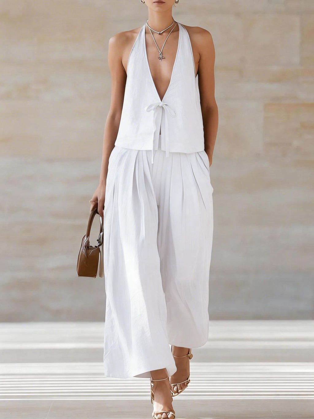 Women's sleeveless vest and wide-leg pants set by FitiqueFit, featuring a lace-up casualwear outfit with stylish design.