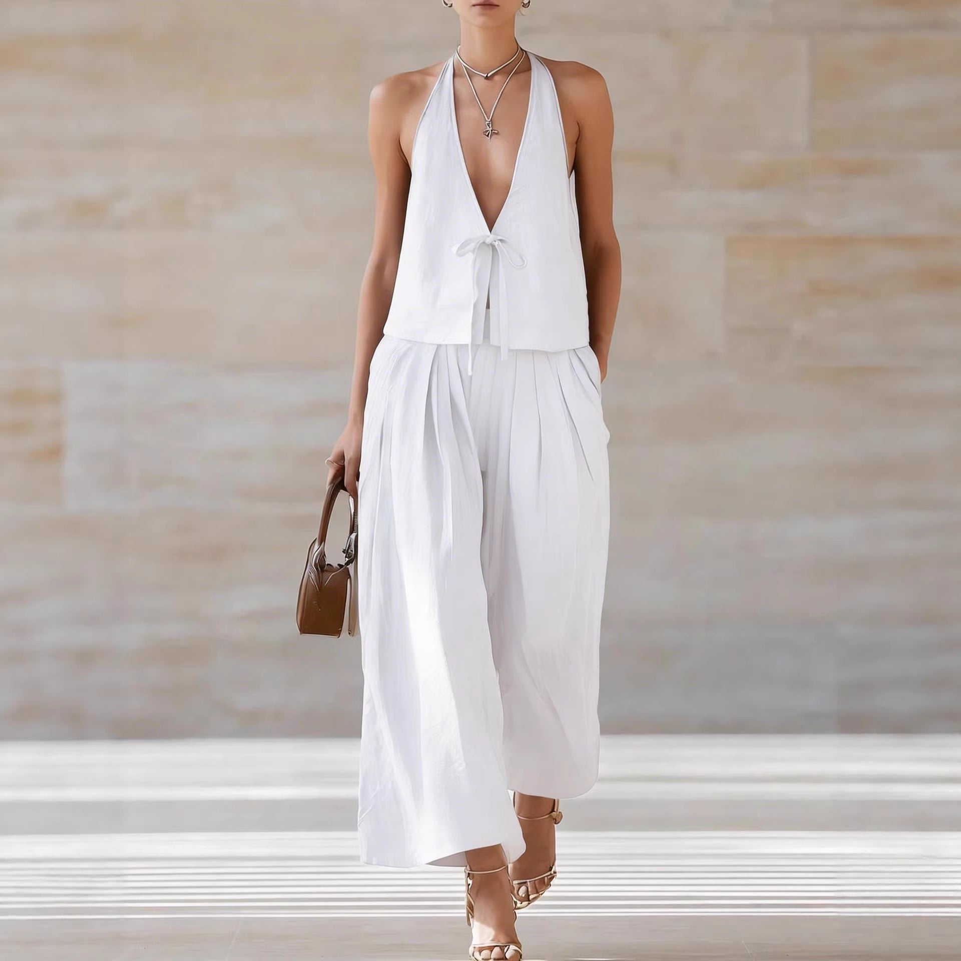 Women's sleeveless vest and wide-leg pants set in lace-up casualwear by FitiqueFit, featuring a stylish, comfortable 2-piece outfit.
