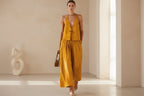 Women's sleeveless vest and wide-leg pants set by FitiqueFit, casualwear with lace-up details, perfect for a relaxed stylish look.