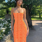 Women's slim fit printed backless casual dress by FitiqueFit, showcasing a stylish backless design and vibrant print.