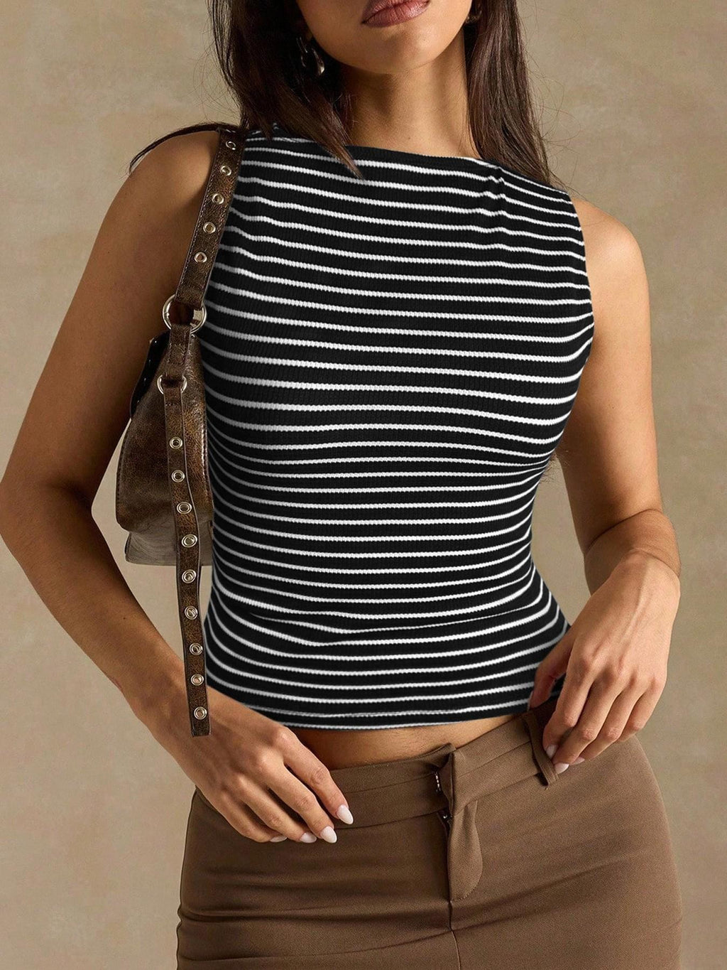 Women’s slim fit striped vest top by FitiqueFit, casualwear, featuring a sleeveless design with horizontal stripes and a fitted silhouette.