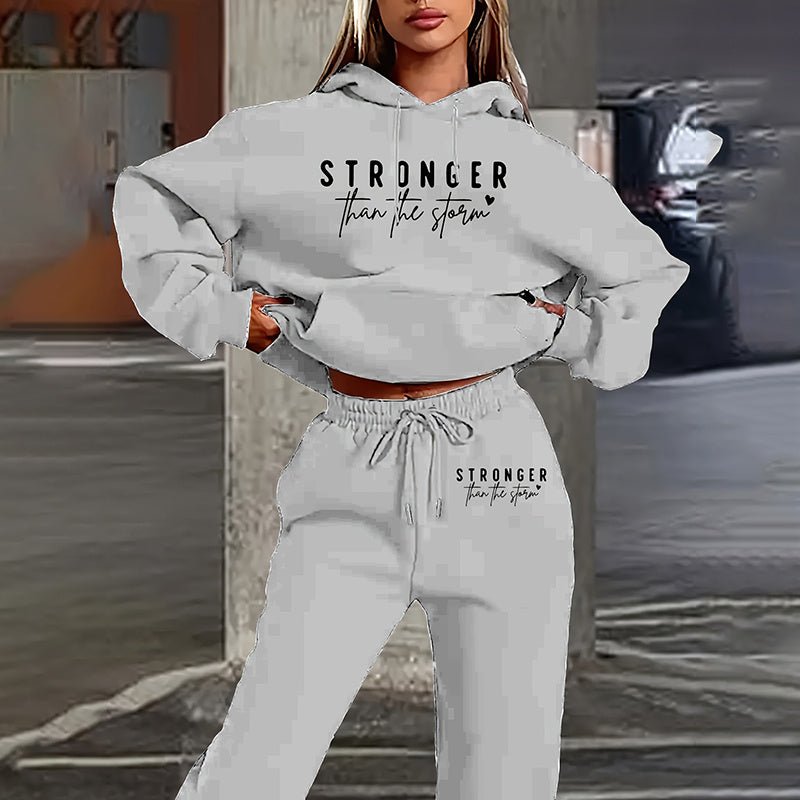 Women's solid 2-piece hoodie set with letter print and front pocket by FitiqueFit, featuring a cozy hoodie and matching pants.