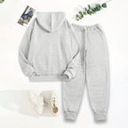 Women's solid 2-piece hoodie set with letter print and front pocket by FitiqueFit, includes hoodie and matching pants.