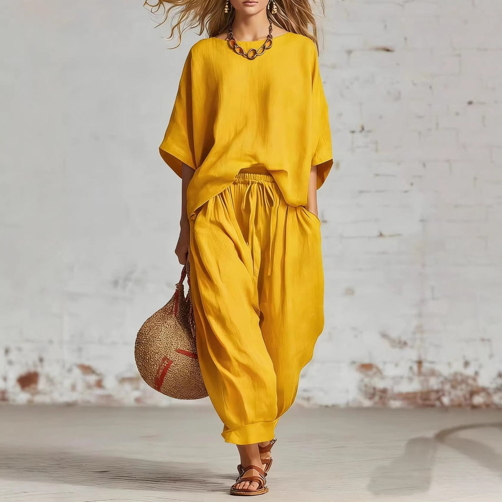 Women's solid color casual set by FitiqueFit featuring a loose T-shirt and ankle pants, perfect for comfortable everyday wear.