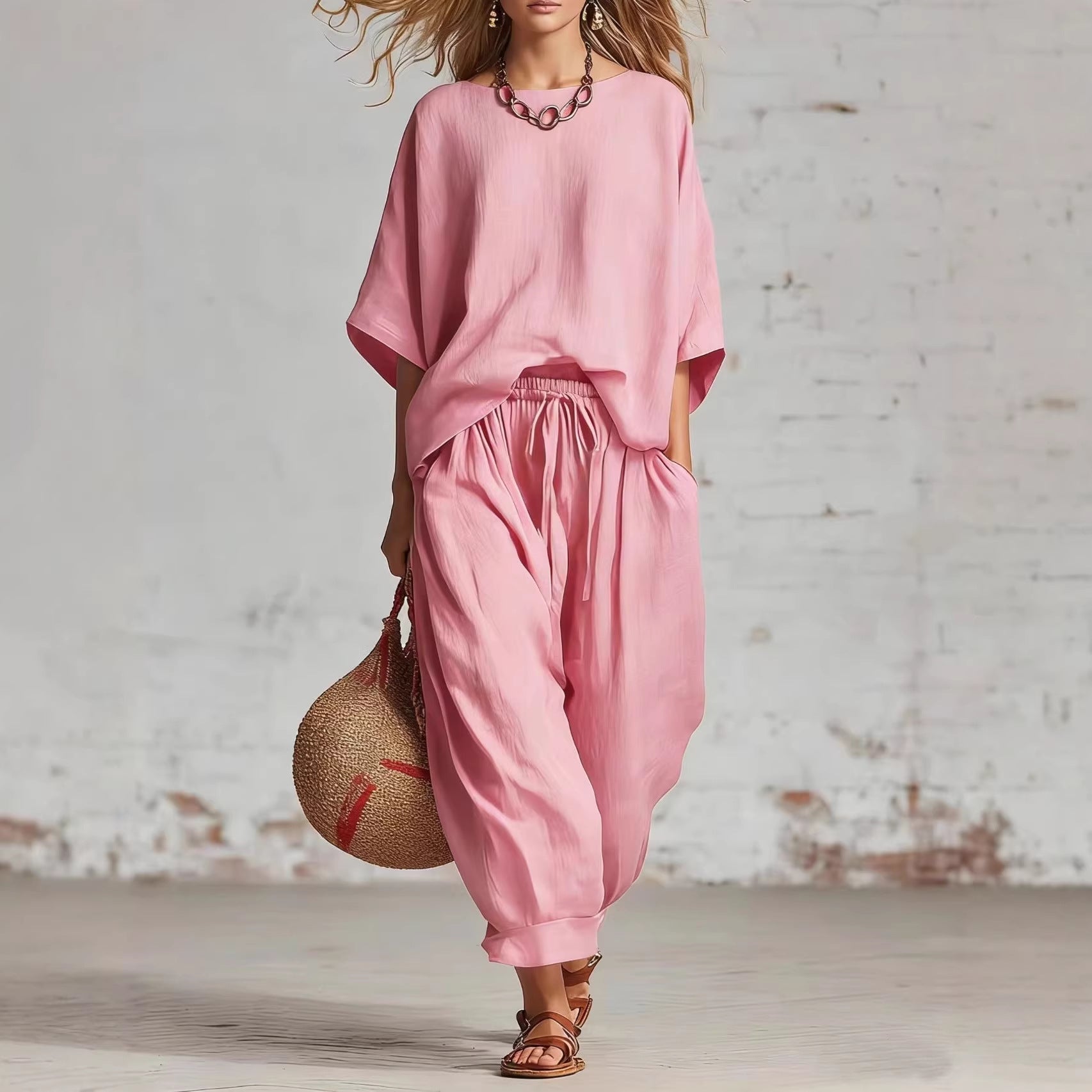Women's solid color casual set with a loose T-shirt and ankle pants from FitiqueFit, displayed on a model.