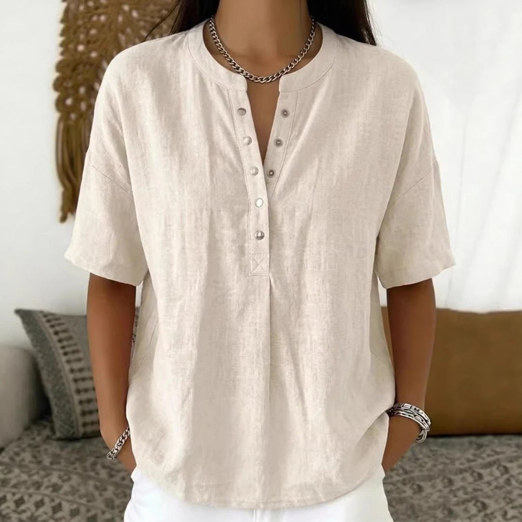 Women's loose-fit short-sleeve pullover top in solid color, casualwear by FitiqueFit, shown on a model.