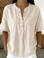 Women's solid color loose-fit short-sleeve pullover top by FitiqueFit, casualwear style, shown in a relaxed fit design.