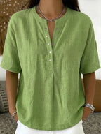 Women’s solid color loose-fit short-sleeve pullover top by FitiqueFit, casualwear, displayed on a model.