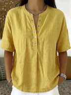 Women's solid color loose-fit short-sleeve pullover top by FitiqueFit, casualwear, showing a relaxed fit and simple round neckline.