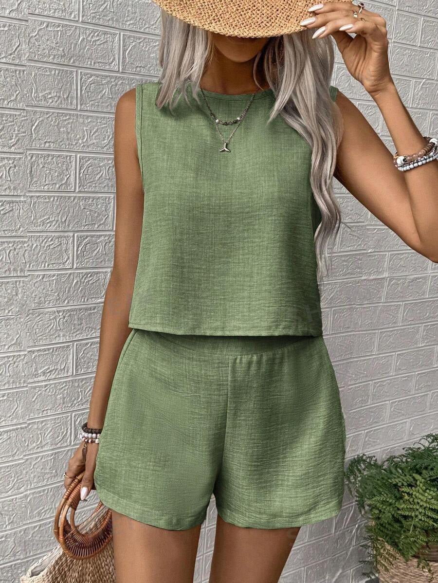 Women's solid color sleeveless vest and shorts set by FitiqueFit, casualwear outfit with a sleeveless top and matching shorts.
