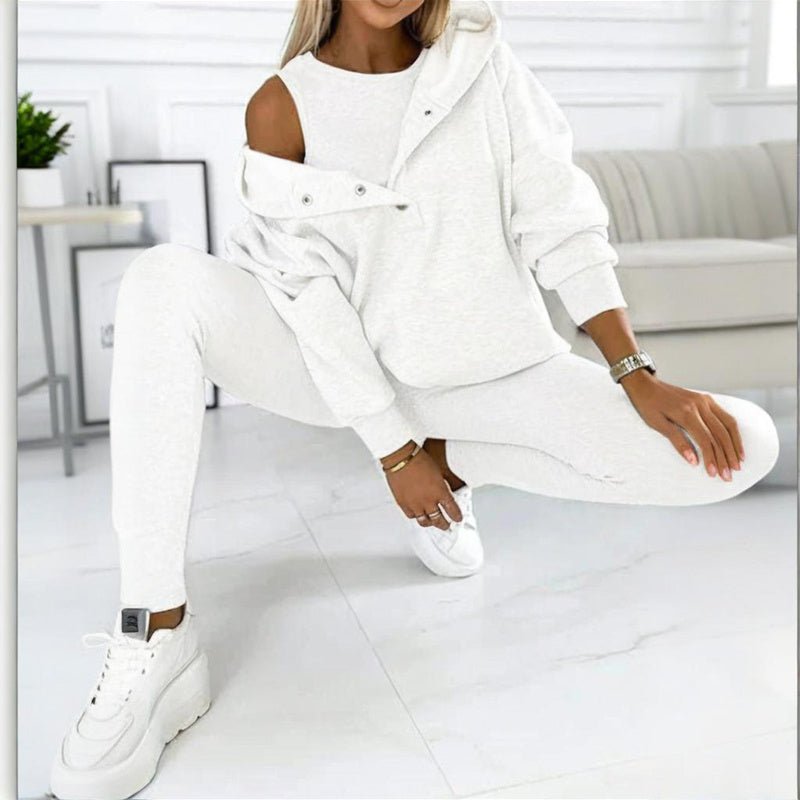 Women’s solid color three-piece casualwear set by FitiqueFit, featuring a coordinated top, pants, and jacket in a neutral shade.
