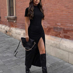Women’s solid-colored short-sleeve mock neck pleated slit dress by FitiqueFit, featuring a casual, elegant design with a flowy silhouette.