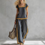 Women’s casual two-piece pants set by FitiqueFit featuring a square neck short sleeve top and matching pants.