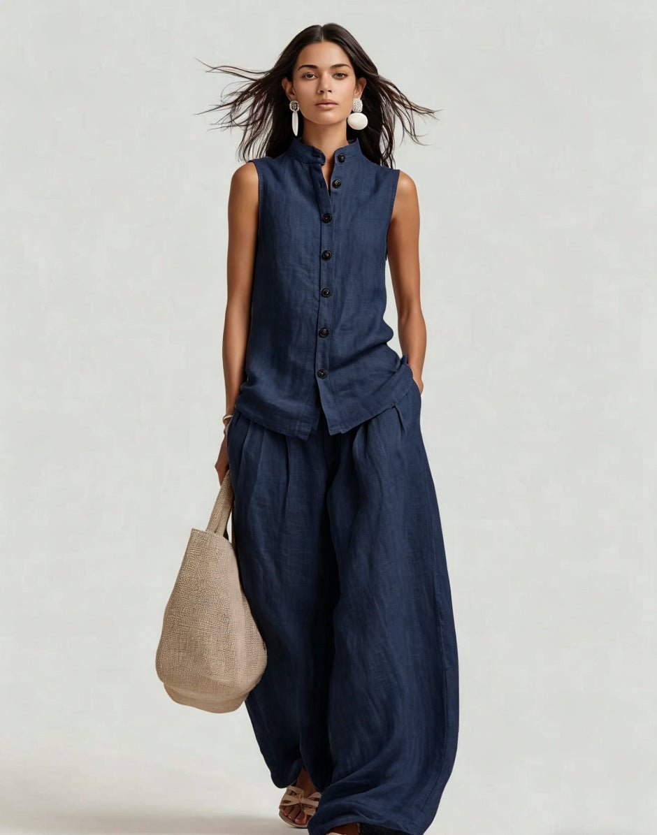 Women's casualwear set by FitiqueFit featuring a sleeveless stand collar top and high-waist wide-leg pants on a model.