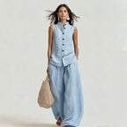 Women's casualwear set with a stand collar sleeveless top and high-waist wide-leg pants by FitiqueFit, shown on a model.