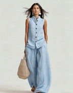 Women's casualwear set with a sleeveless stand collar top and high-waist wide-leg pants by FitiqueFit, shown on a model.