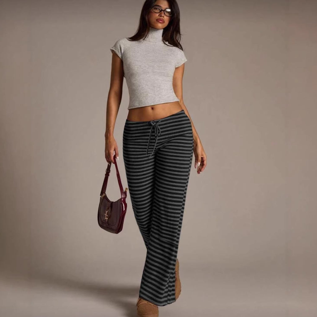 Women’s striped wide-leg flared casual pants by FitiqueFit, featuring a relaxed fit and bold vertical stripe pattern.