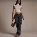 Women’s striped wide-leg flared casual pants by FitiqueFit, featuring a relaxed fit and bold vertical stripe pattern.