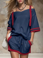 Women's summer contrast color-block patchwork shorts set by FitiqueFit, featuring a casual 2-piece outfit with vibrant color blocks.