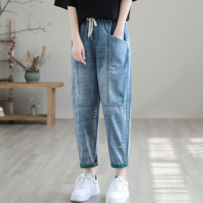 Women’s summer streetwear ripped Ninth jeans by FitiqueFit, featuring distressed details and a casual, trendy fit.