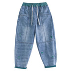 Women's summer streetwear ripped Ninth jeans by FitiqueFit, showcasing distressed denim with frayed hems and trendy styling.