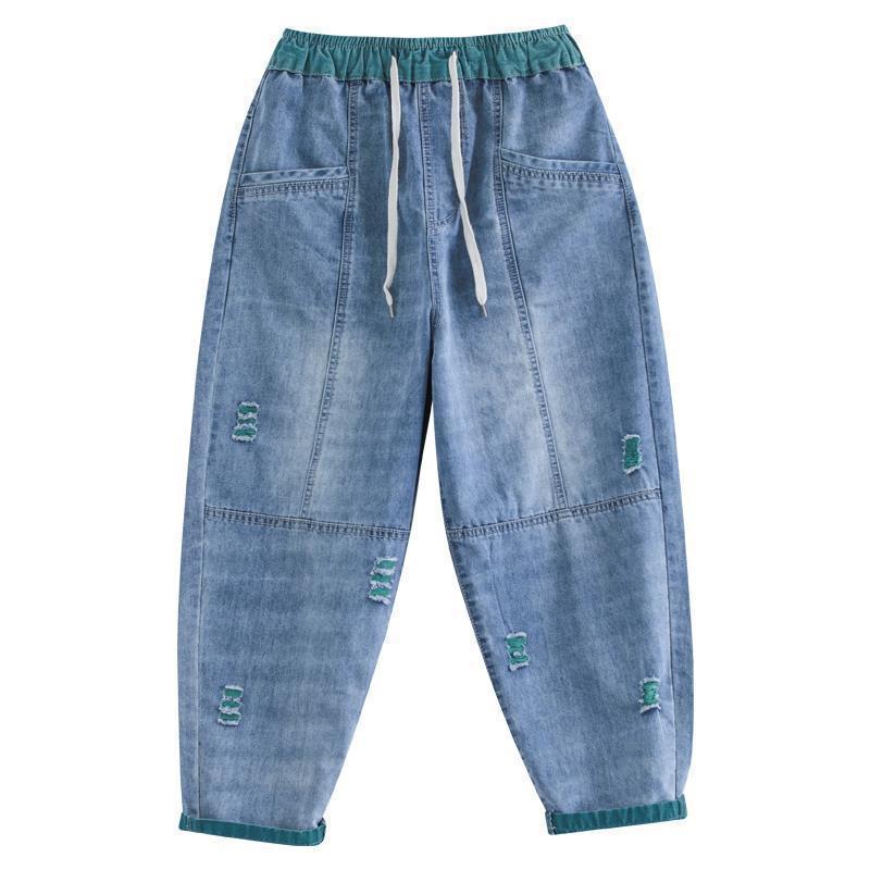 Women's summer streetwear ripped Ninth jeans by FitiqueFit, showcasing distressed denim with frayed hems and trendy styling.