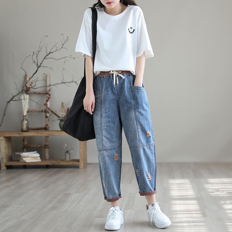 Women's summer fashion ripped Ninth jeans by FitiqueFit, showcasing distressed denim with a trendy streetwear style.