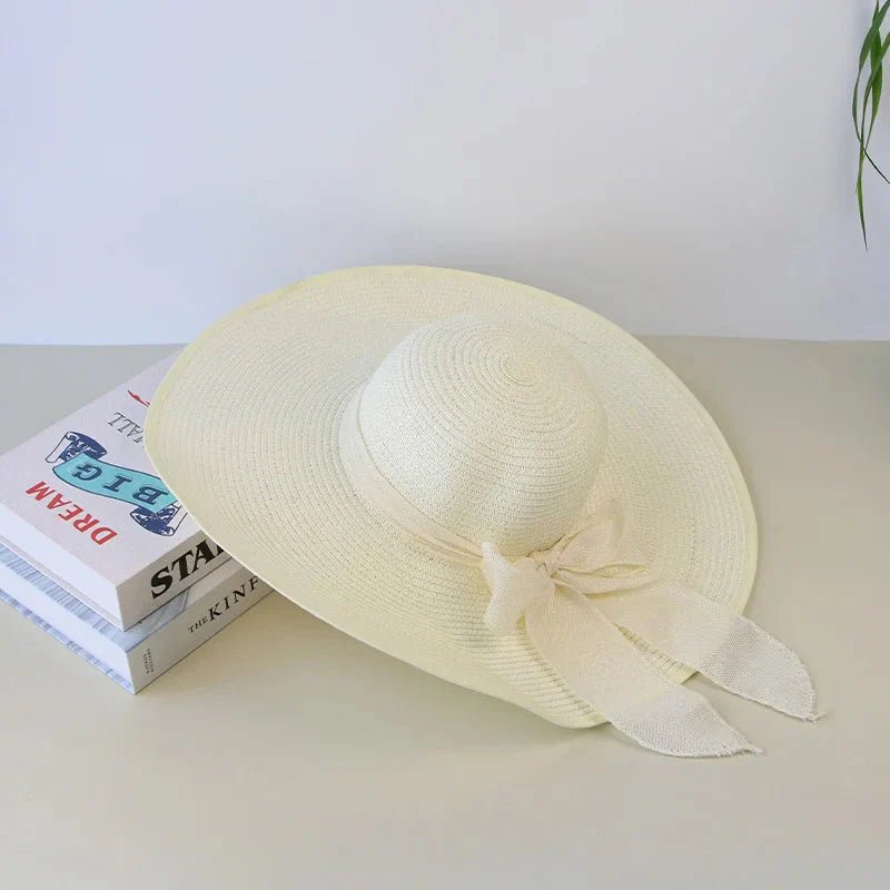 Women’s summer straw hat from FitiqueFit featuring a wide brim and breathable design for sun protection.