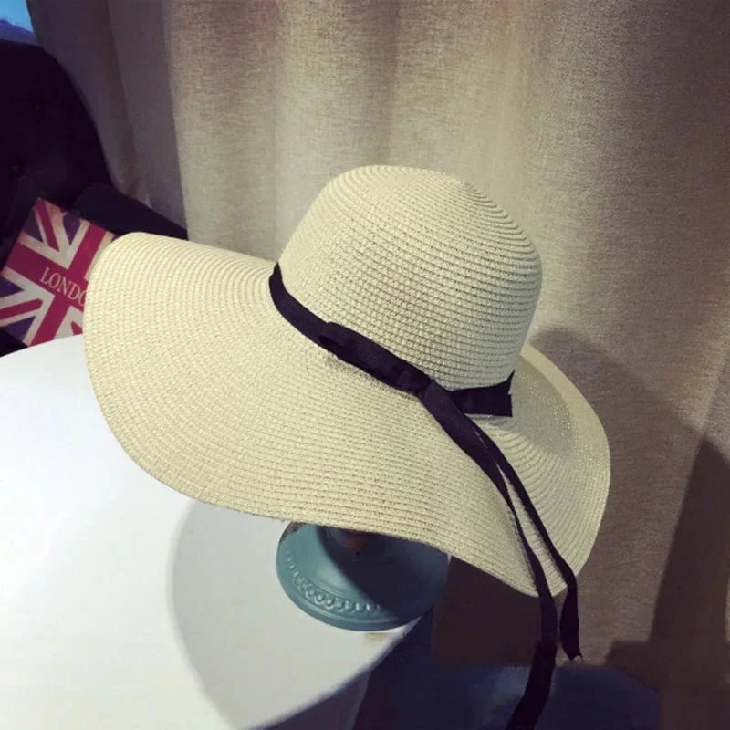 Women’s summer straw hat from FitiqueFit featuring wide brim and woven straw design for sun protection and stylish summer wear.