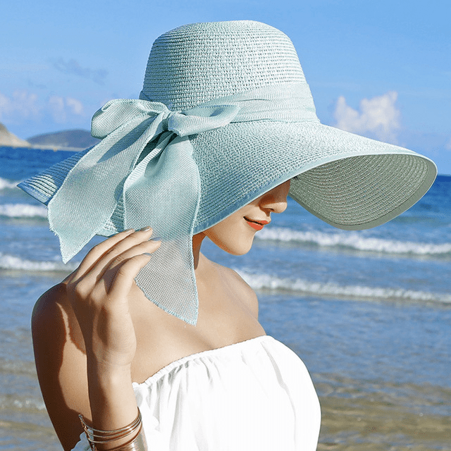 Women’s summer straw hat by FitiqueFit featuring a wide brim and woven texture, perfect for sun protection and stylish summer wear.
