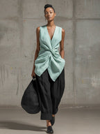 Women's casualwear set featuring a tie-front V-neck sleeveless top and wide-leg pants by FitiqueFit, shown on a model.