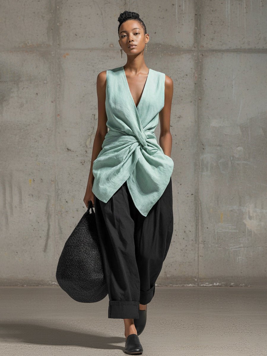 Women's casualwear set featuring a tie-front V-neck sleeveless top and wide-leg pants by FitiqueFit, shown on a model.