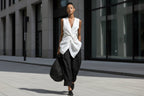 Women's casualwear set featuring a tie-front V-neck sleeveless top and wide-leg pants by FitiqueFit, shown on a model.