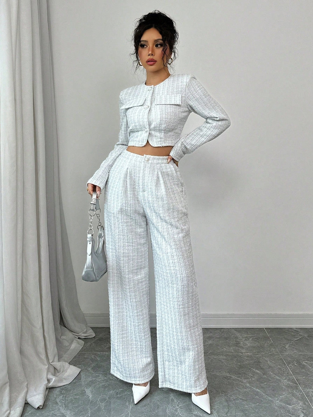 Women’s tweed pearl-button jacket and pants set by FitiqueFit, casualwear ensemble featuring textured fabric and elegant buttons.