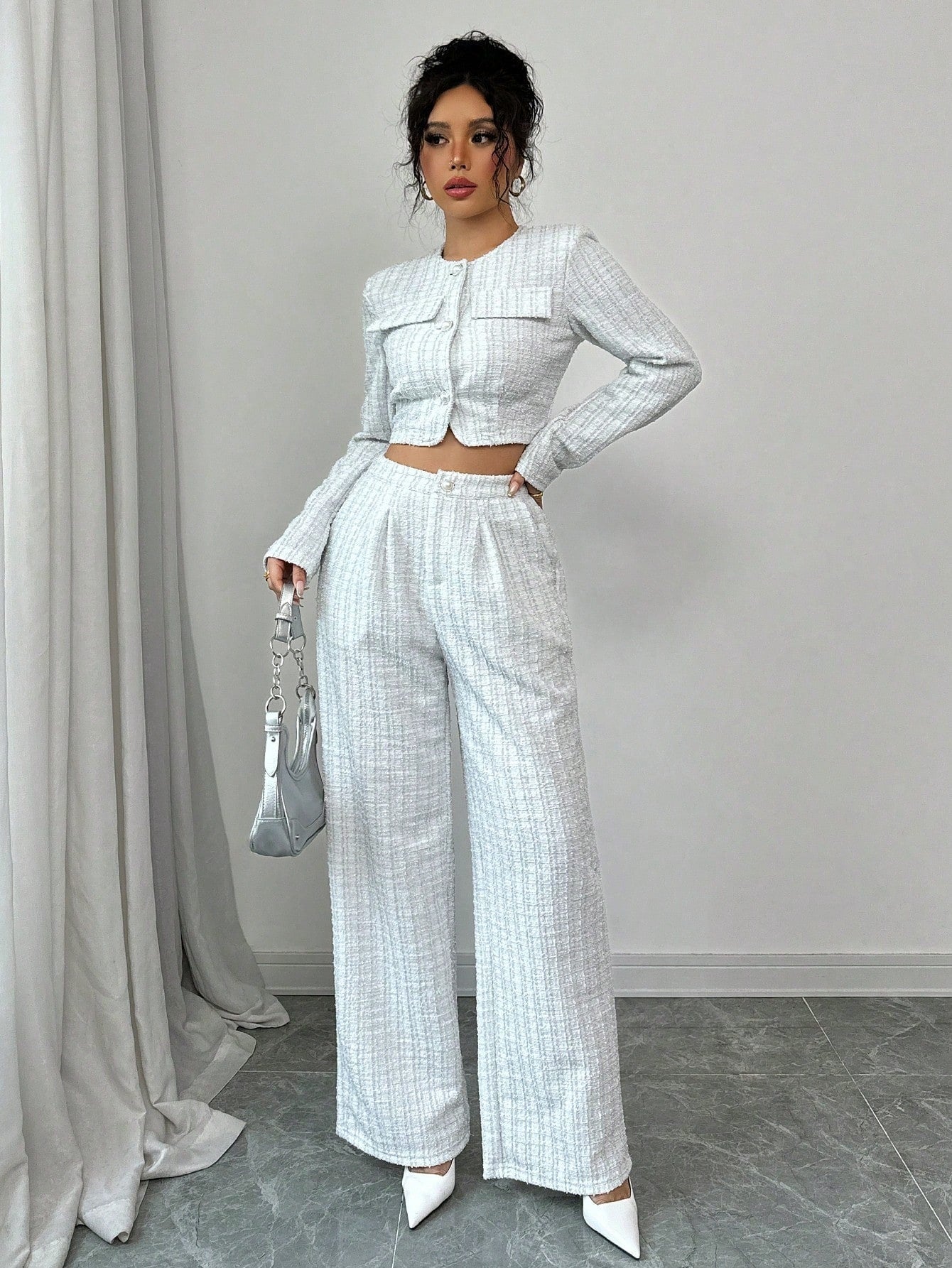 Women’s tweed pearl-button jacket and pants set by FitiqueFit, casualwear ensemble featuring textured fabric and elegant buttons.
