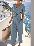 Plus size women's twist-front V-neck lounge set with pockets, comfortable and stylish clothing set from Trendsi.